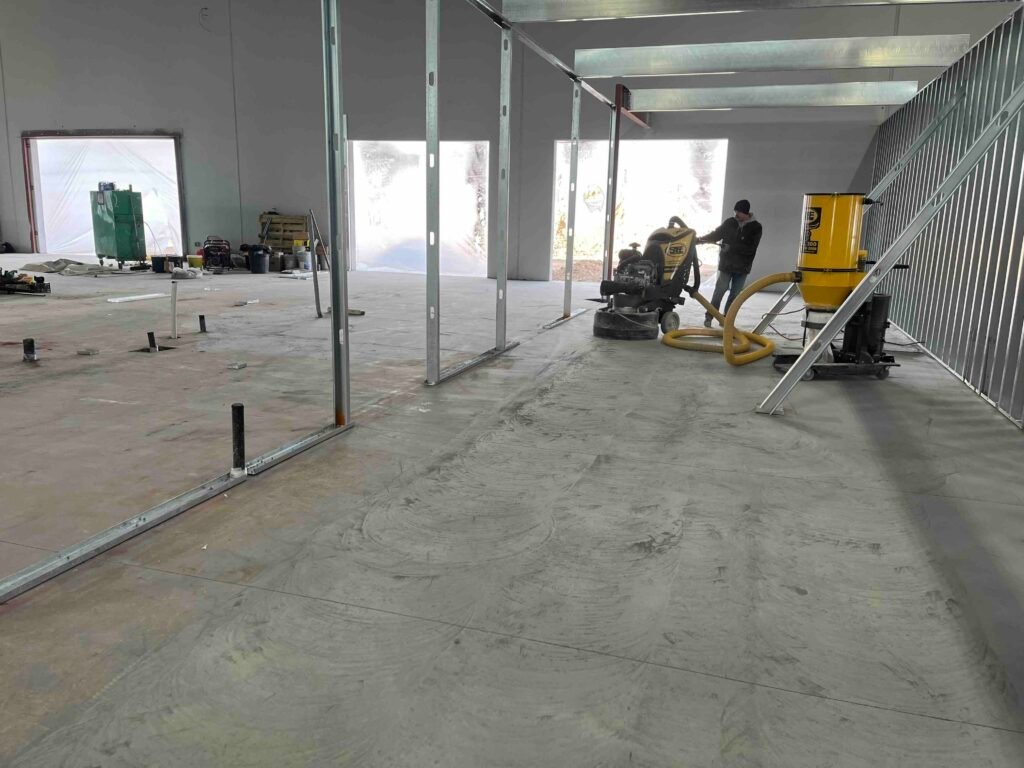 Concrete polishing work in progress at Mygrant Glass