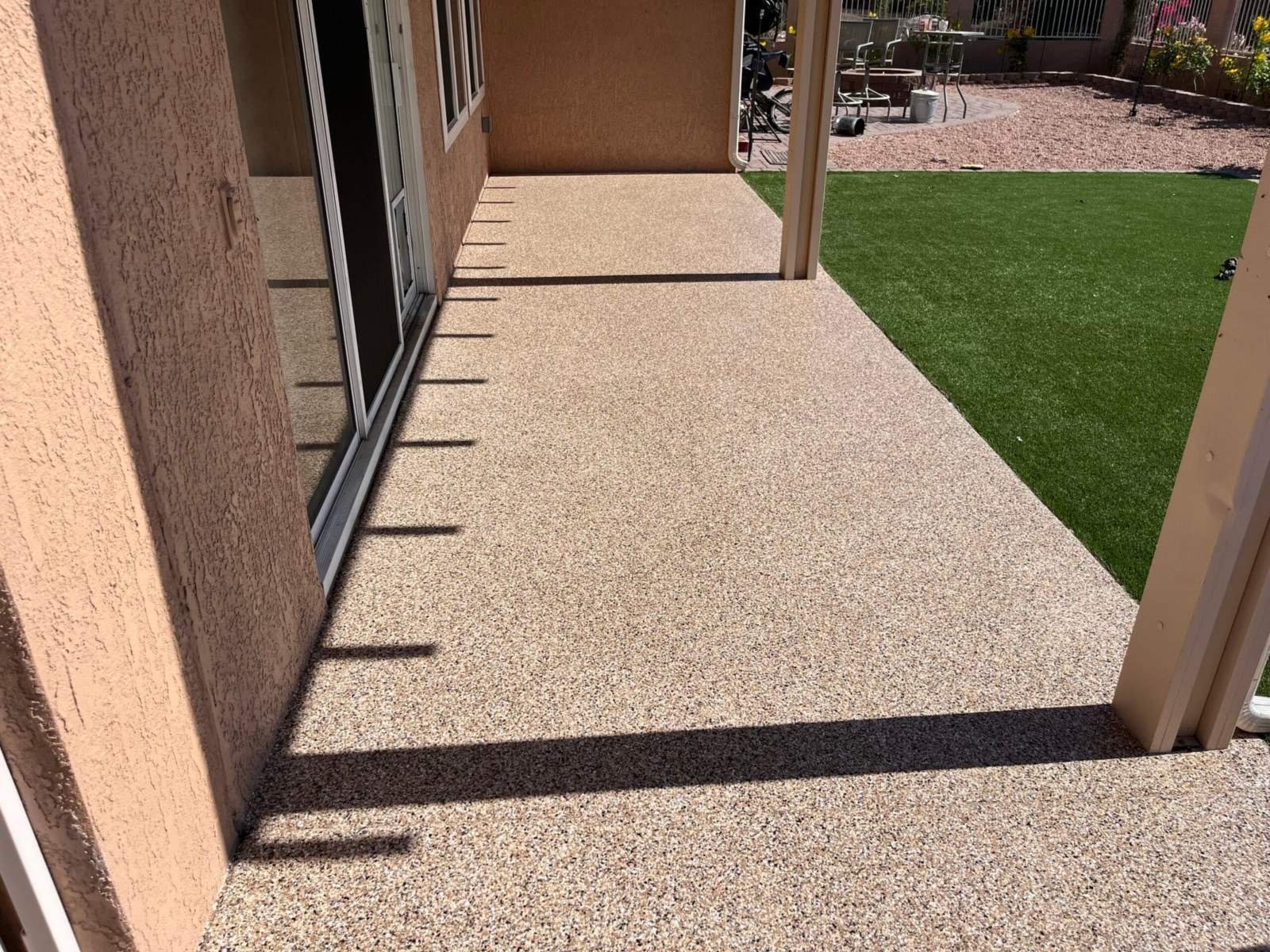 Decorative flake coating on a covered patio at an Arizona home, installed by AZF Experts