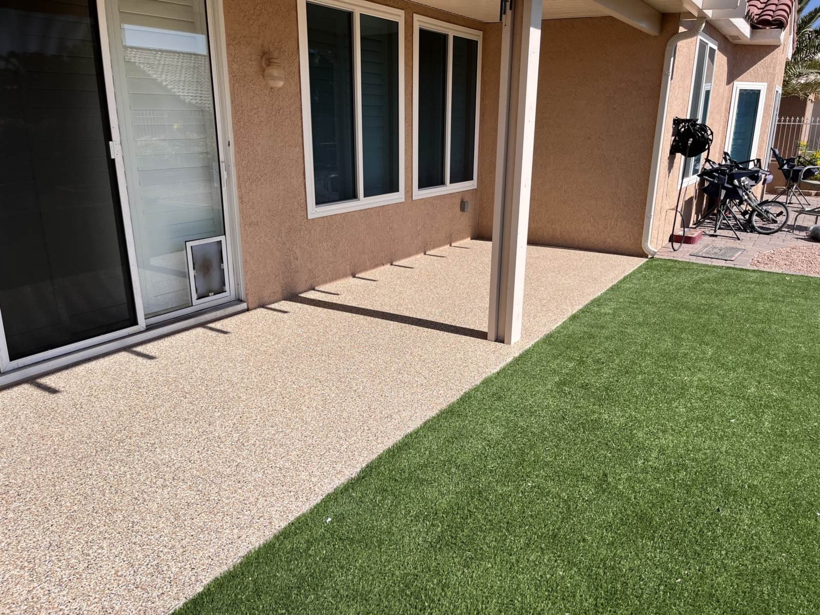 Flake epoxy coating on a covered back patio at an Arizona home, installed by AZF Experts